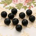 Macro detail of matte black 15mm silicone beads with threading holes for DIY bracelets - 10 Pieces/Pack (15mm) / Black