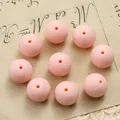Detailed close-up of 15mm pink silicone beads with central hole for DIY jewelry making - 10 Pieces/Pack (15mm) / Pink
