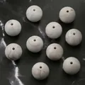 Detailed view of 15mm round silicone beads with white and tan marble texture for DIY jewelry - 10 Pieces/Pack (15mm) / Marble White