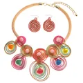 Detailed shot of bohemian colorful wire-wrapped spiral discs on gold mesh tube necklace - Multi-Layer African Tribal Necklace Earrings