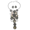 Detailed view of tribal jewelry set with spiral metallic coils and brown resin gemstones - Black Floral African Tribal Necklace Earrings