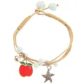 Detail of woven bracelet featuring red apple pendant, silver bell and starfish charm - Red Apple