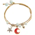 Detailed macro of ceramic bead bracelet with silver starfish and golden moon charms - Red Moon