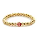 Elastic gold bead bracelet featuring a red circular charm with letter E initial - Letter E Style