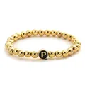 Detail of golden beaded elastic bracelet with a black circular letter P pendant - Letter P Style