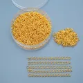 Golden necklace extension chains with round storage box and organized sample rows - Gold