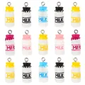 Macro shot of 15 colorful resin milk bottle pendants with silver loops in a grid layout - Multicolor