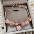 Rose gold snake chain bracelet with pink enamel flower, swan, and heart charms - Rose Gold