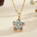 Golden five-petal flower necklace with iridescent gemstones and sparkling zircon accents - Colorful