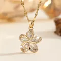 Golden five-petal flower necklace with clear zircons and shimmering wave chain - White
