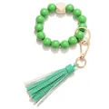 Detail of green wooden beads wristlet keychain with gold clasp and leather tassel - Green