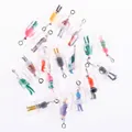 Detailed view of colorful miniature figures inside clear pill capsule pendant charms - Human Figure Pill