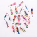 Macro shot of creative transparent pill charms with mini fruit and character fillings - Mixed Style Pill