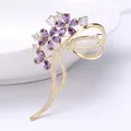 Elegant gold-plated flower brooch with purple zircon petals and a crystal bow accent - Purple Zirconia Floral Style / Purple