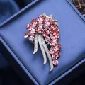 Elegant silver brooch with pink zircon crystals in a floral design for coats - Pink
