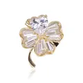 Detail of four-leaf clover brooch with heart and baguette cut crystals in gold setting - Gold