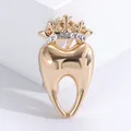 Detail of creative crown tooth brooch with gold plating and sparkling rhinestones - Gold