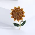 Sunflower brooch with amber rhinestones and green enamel on a golden alloy base - Yellow