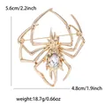Exquisito broche de araña dorado con gran cristal de lágrima para trajes y abrigos - Piedra Clara / Dorado