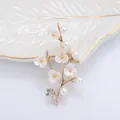 Elegant gold flower brooch with freshwater pearls and plum blossom details for women - Gold