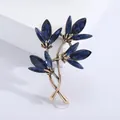Vintage orchid brooch with navy blue faceted gems and antique gold finish details - Gold Blue