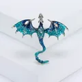 Detailed view of pterosaur brooch with blue enamel wings and sparkling rhinestones - Blue