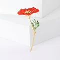 Elegant red flower brooch with gold stamens and green leaves on white geometric blocks - Red