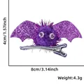 Size and weight details for purple glitter bat hair clip with plush ball and googly eyes - Purple