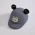 Detail van de kinderpet met panda-oren en blauw ruitpatroon in houndstooth-stijl - 50-52CM / Blauw Zwart Wit Hahnentritt