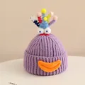 Close-up of purple knit monster hat with thick texture and colorful quirky 3D elements - 2-6 Years Old / Purple