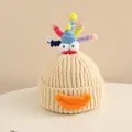Detailed close-up of a creative monster knit hat with colorful spirals and star sequins - 2-6 Years Old / Beige