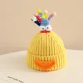 Detailed knit texture of a yellow monster hat with 3D eyes and colorful plush accents - 2-6 Years Old / Yellow