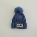 Deep blue winter knit beanie for kids featuring a fluffy pom-pom and MAKE embroidery - Children 3-10 Years Old / MAKE Letter Patch Style / Blue