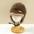 Brown winter trapper hat for kids featuring warm faux fur lining and adjustable chin strap - Kids / Coffee