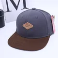 Kids flat brim baseball cap featuring charcoal crown and brown brim with leather patch - Kids Adjustable Size / Dark Gray And Brown Style