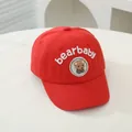 Detail of red kids baseball cap with bearbaby embroidery and cute brown bear patch - Infant One Size / Red