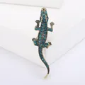 Spilla vintage a forma di coccodrillo in lega d'oro con strass verde acqua su bianco - Coccodrillo Oro Vintage (0999) / Oro - Strass Ciano