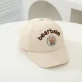Detail of beige baby baseball cap featuring 3D bear plush and bearbaby embroidery - Infant One Size / Beige