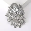 Macro shot of silver vintage brooch with pear-shaped crystal and flower petals - Silver