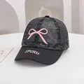 Detailed shot of breathable black lace mesh fabric and pink bow on summer mesh cap - Adjustable Toddler Size / Black