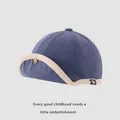 Berretto neonato in velluto a coste blu scuro con bordo beige e bottone metallico - Neonato (46-48cm) / Blu