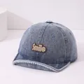 Blue denim toddler baseball cap featuring a brown Smile patch and a soft rounded brim - Smile Patch / Dark Blue