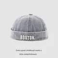 Detail of light blue denim skull cap with white BOSTON embroidery and washed texture - 48-50cm / Medium Blue BOSTON