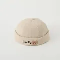 Detailed close-up of corduroy texture and Lucky bear embroidery on the beige skull cap - Toddlers 2-5 Years 50-52CM / Beige