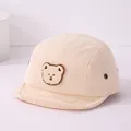 Casquette bébé en velours côtelé crème avec bord souple et écusson ours mignon - 46-48 cm / Style Ours en Peluche Beige