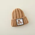 Brown knitted baby beanie featuring a cute teddy bear patch for winter warmth - 2-7 Years (Elastic) / Light Coffee