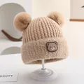 Winter knit baby hat in warm beige featuring fluffy double pom-poms and a bear patch - Rubber Bear Badge Style (Style 3) / Khaki