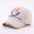 Detail view of cotton canvas kids baseball cap with smiley face print and embroidery - 48-52cm / Beige