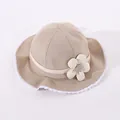 Close-up of baby sun hat with delicate white lace trim and 3D fabric flower detail - Toddler One Size / Khaki