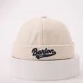 Detailed close-up of cream docker hat showing twill texture and Barton embroidery - One Size / Beige